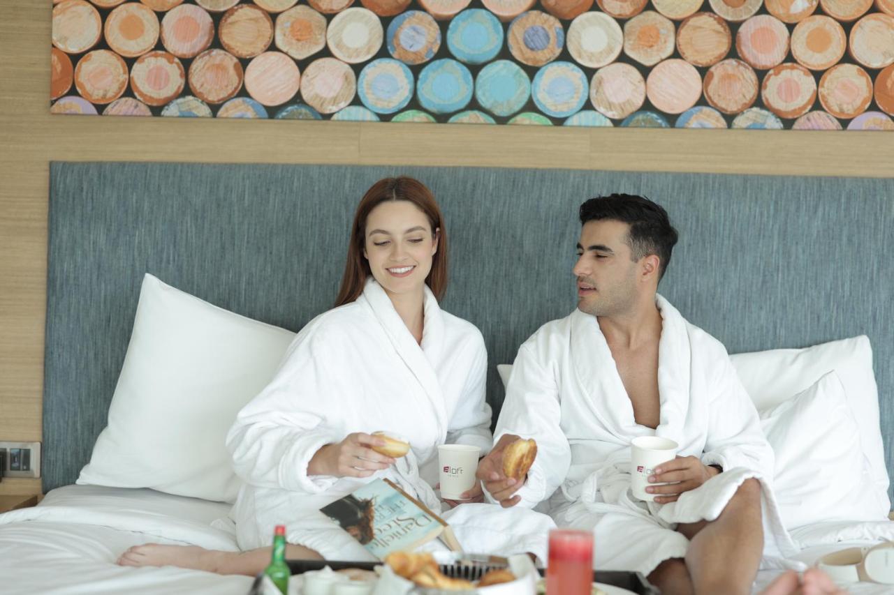 Aloft New Delhi Aerocity Eksteriør bilde A couple wearing bathrobes